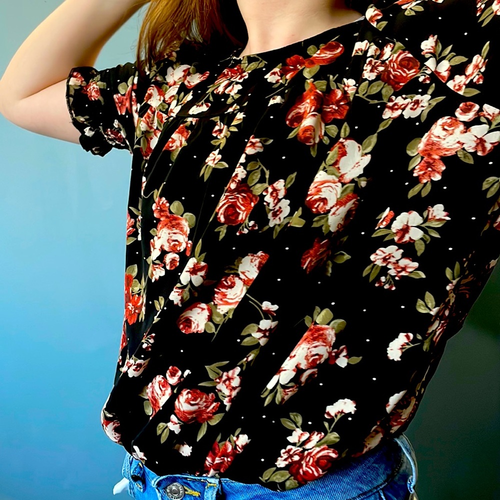 Red flowers and black blouse